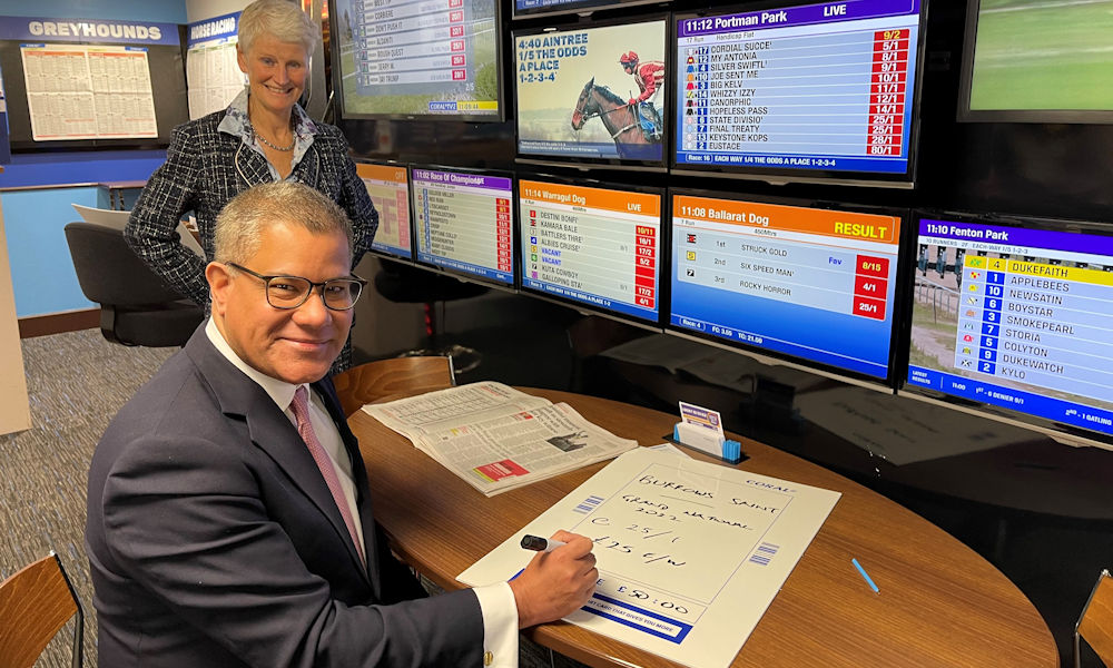 Alok Sharma visits the Theale branch of Coral to place a charity bet on the Grand National